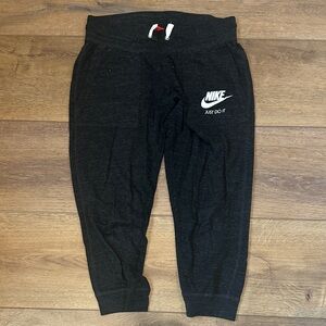 Nike women’s charcoal Heather Joggers with White Logo